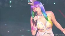 MILEY CYRUS SHOWS OFF HER SLIM BODY WITH HUGE DILDO ON A STAGE